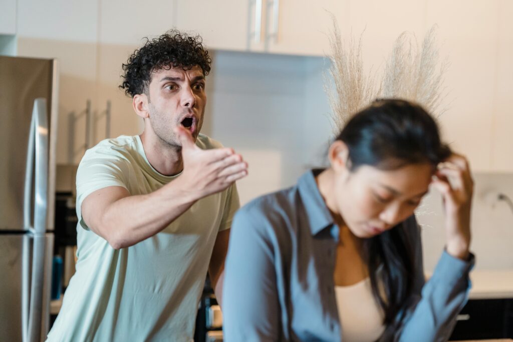 pexels-photo-8560842-8560842 A stressed couple arguing in a modern kitchen, highlighting relationship issues.